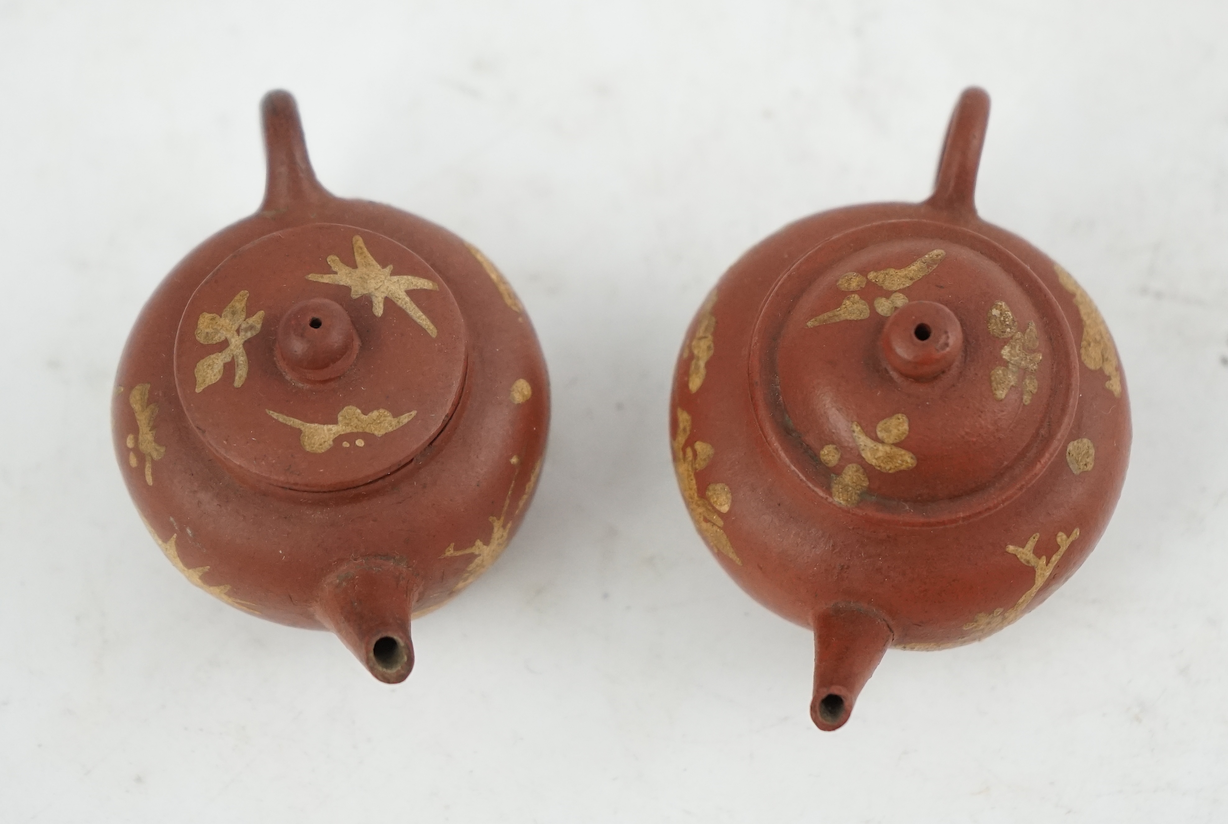 Two Chinese Yixing slip-decorated miniature teapots and covers, 18th/19th century